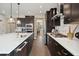 Gourmet kitchen featuring a large center island, stainless appliances, and dark cabinetry with gold accents at 2280 Minfarm Way # 529, Mount Pleasant, SC 29466