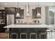 Modern kitchen with a spacious island, dark cabinets, stainless steel appliances, and stylish pendant lights at 2280 Minfarm Way # 529, Mount Pleasant, SC 29466