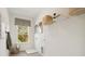 Bright laundry room with a window, storage shelves, cleaning supplies and gray tile flooring at 2280 Minfarm Way # 529, Mount Pleasant, SC 29466
