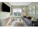 Cozy living room with modern entertainment center, gray sofa, and ample natural light at 2280 Minfarm Way # 529, Mount Pleasant, SC 29466