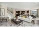 Spacious and modern living room with open layout, including view of staircase, kitchen, dining and living spaces at 2280 Minfarm Way # 529, Mount Pleasant, SC 29466