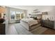 Serene main bedroom with plush bedding, side tables, and lots of natural light at 2280 Minfarm Way # 529, Mount Pleasant, SC 29466