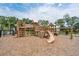 Community playground offers fun with climbing structures and a slide on a wood chip ground cover at 2280 Minfarm Way # 529, Mount Pleasant, SC 29466