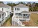 Back of the home with a porch, stair access, and beautiful backyard at 2280 Minfarm Way # 529, Mount Pleasant, SC 29466