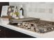 Stainless steel gas stovetop with a modern tile backsplash, perfect for the at-home chef at 2280 Minfarm Way # 529, Mount Pleasant, SC 29466