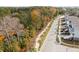 A view of a neighborhood street lined with palm trees and sidewalks, showcasing the homes at 2280 Minfarm Way # 529, Mount Pleasant, SC 29466