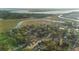 An aerial view shows the home nestled between the lush foliage and winding waterways at 257 Druid Rd, Charleston, SC 29407