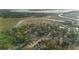 An aerial view shows the home nestled between the lush foliage and winding waterways at 257 Druid Rd, Charleston, SC 29407