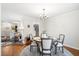 Inviting dining room with hardwood floors, chandelier lighting, and a round dining table at 257 Druid Rd, Charleston, SC 29407