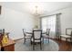 Bright dining room featuring hardwood floors, natural light, and seating for four at 257 Druid Rd, Charleston, SC 29407