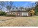 Charming single-story brick home featuring a well-manicured front lawn and cozy curb appeal at 257 Druid Rd, Charleston, SC 29407