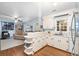 Bright, airy kitchen featuring white cabinets, modern appliances, and an open layout flowing into the living area at 257 Druid Rd, Charleston, SC 29407
