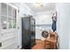 Efficient laundry area with washer, dryer, cabinets and a secure gun safe, all in a well-lit space at 257 Druid Rd, Charleston, SC 29407