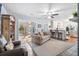 Cozy living room with neutral furnishings, natural light, and seamless transition to the adjacent kitchen at 257 Druid Rd, Charleston, SC 29407