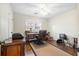 Functional home office with a vintage desk, ample storage, and bright natural light for a productive workspace at 257 Druid Rd, Charleston, SC 29407