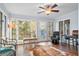 Bright sunroom filled with natural light from numerous windows, creating a perfect space for relaxation at 257 Druid Rd, Charleston, SC 29407