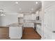 Open kitchen with white cabinets, granite countertops, and stainless steel appliances at 2838 Otranto Rd, North Charleston, SC 29406