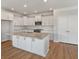 Open kitchen with white cabinets, granite countertops, and stainless steel appliances at 2838 Otranto Rd, North Charleston, SC 29406