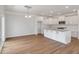 Open kitchen with white cabinets, granite countertops, and stainless steel appliances at 2838 Otranto Rd, North Charleston, SC 29406