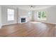 Bright living room featuring a fireplace and large windows offering natural light at 2838 Otranto Rd, North Charleston, SC 29406