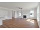 Spacious living room with fireplace, ceiling fan, and hardwood flooring at 2838 Otranto Rd, North Charleston, SC 29406