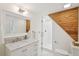 Bathroom features a modern vanity and a glass-enclosed shower with wood paneling at 285 Grove St, Charleston, SC 29403