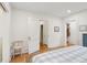 Bright bedroom with hardwood floors, neutral walls, and an ensuite bathroom, and a closet at 285 Grove St, Charleston, SC 29403