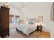 Airy bedroom features beautiful windows, wicker chair, and elegant decor at 285 Grove St, Charleston, SC 29403