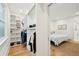 Walk-in closet with built-in shelving and an opening to the bedroom at 285 Grove St, Charleston, SC 29403