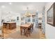 Open concept dining area with wood floors and view of kitchen at 285 Grove St, Charleston, SC 29403