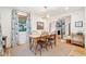 Dining room with wood floors, decorative rug, and ample natural light at 285 Grove St, Charleston, SC 29403
