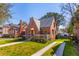 Beautiful brick home with manicured lawn, detailed porch, and classic architectural features at 285 Grove St, Charleston, SC 29403