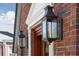 Elegant home with detailed brickwork, classic lantern sconces, and a welcoming front entrance at 285 Grove St, Charleston, SC 29403