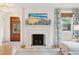Cozy living room featuring a marble fireplace, floral curtains, and a striped rug at 285 Grove St, Charleston, SC 29403