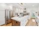 Modern kitchen with white cabinets, quartz countertops, and stainless steel appliances at 285 Grove St, Charleston, SC 29403