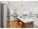 Bright, updated kitchen featuring a large island with seating, stainless appliances, and stylish backsplash at 285 Grove St, Charleston, SC 29403