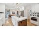 Open-concept kitchen view with large island and breakfast bar, connected to a cozy dining area at 285 Grove St, Charleston, SC 29403