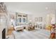 Bright living room with fireplace, ample seating, and a doorway leading to another room at 285 Grove St, Charleston, SC 29403