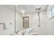 Modern bathroom features a spacious shower with marble tiling and a frameless glass enclosure at 285 Grove St, Charleston, SC 29403
