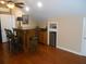 Bar area in bonus room with wood cabinets, counter seating, and mini fridge at 315 King Charles Cir, Summerville, SC 29485