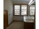 Bright bathroom featuring a double vanity, mirror, and a window with a view at 315 King Charles Cir, Summerville, SC 29485