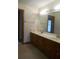 Spacious bathroom with double sinks and vanities, window, and view to a bedroom at 315 King Charles Cir, Summerville, SC 29485