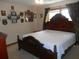 Cozy bedroom featuring a large bed, warm lighting, and decorative wall art at 315 King Charles Cir, Summerville, SC 29485