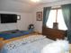 Comfortable bedroom featuring a bed, dresser, curtains, and a television at 315 King Charles Cir, Summerville, SC 29485