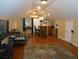 Spacious bonus room featuring a bar, hardwood floors, and unique architectural details at 315 King Charles Cir, Summerville, SC 29485