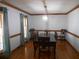 Formal dining room featuring hardwood floors, elegant lighting, and ample seating at 315 King Charles Cir, Summerville, SC 29485