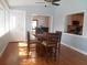 Sunny dining room with wood floors, view to kitchen and Gathering room, and a door to the exterior at 315 King Charles Cir, Summerville, SC 29485