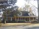 Charming brick home with a welcoming front porch and well-maintained landscaping at 315 King Charles Cir, Summerville, SC 29485