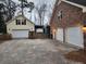 Dual garages for ample parking, plus a covered storage area for a boat or trailer at 315 King Charles Cir, Summerville, SC 29485