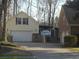 Dual garages for ample parking, plus a covered storage area for a boat or trailer at 315 King Charles Cir, Summerville, SC 29485